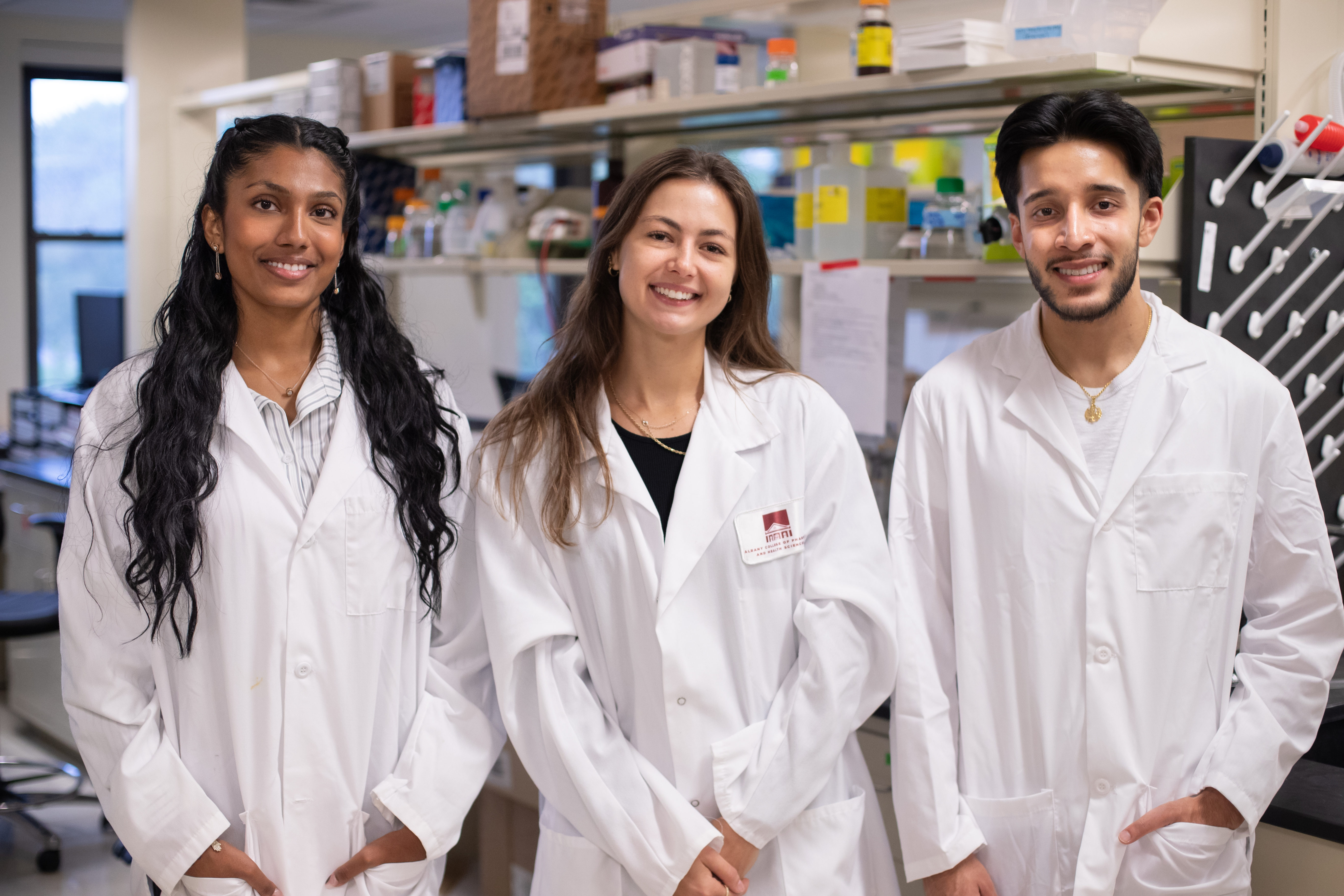 Students Dhatri Sangasani, Diandre Slusarek and Manjot Deol in the lab