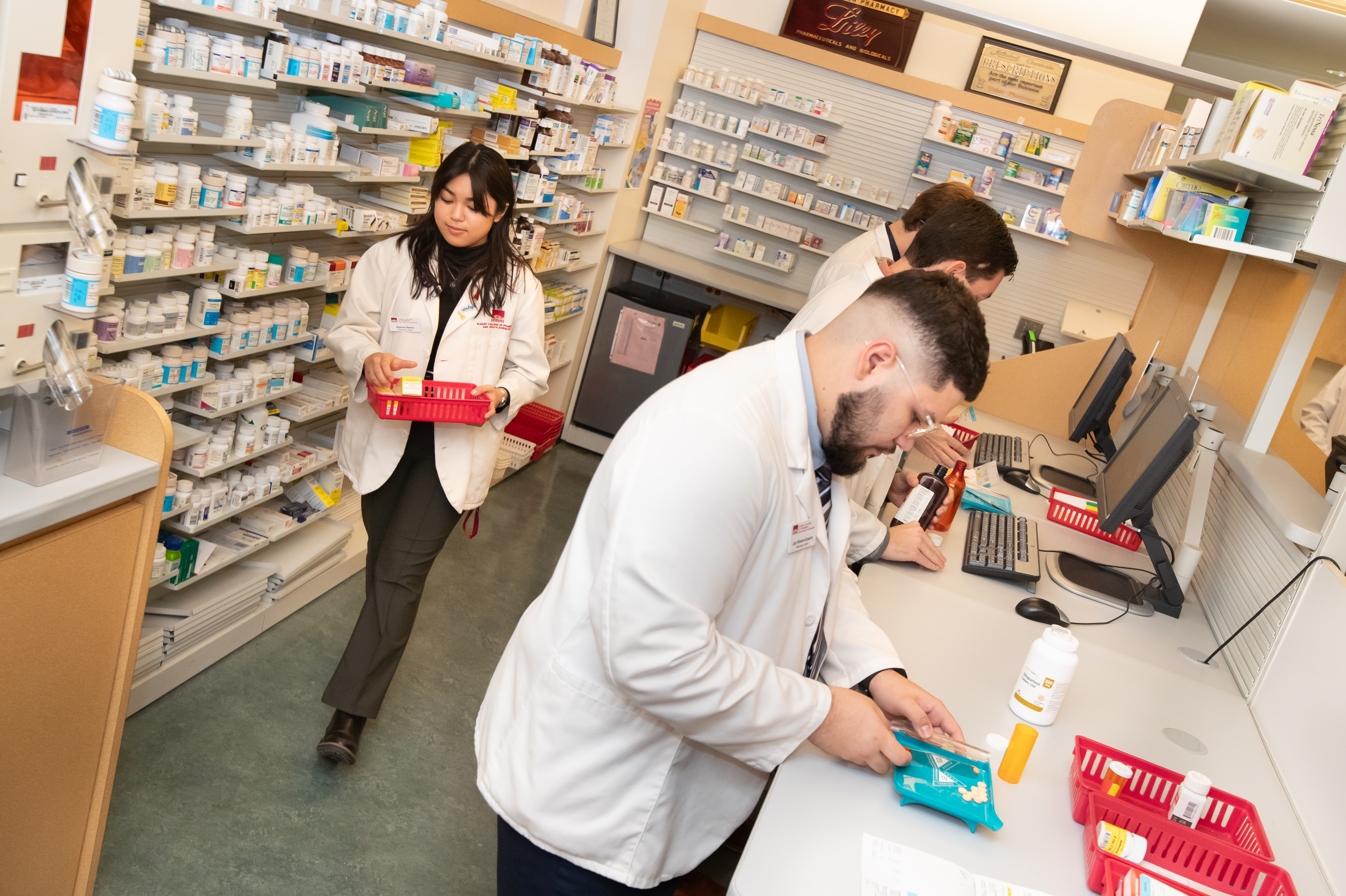 Pharmacy students in the mock pharmacy, October 2024