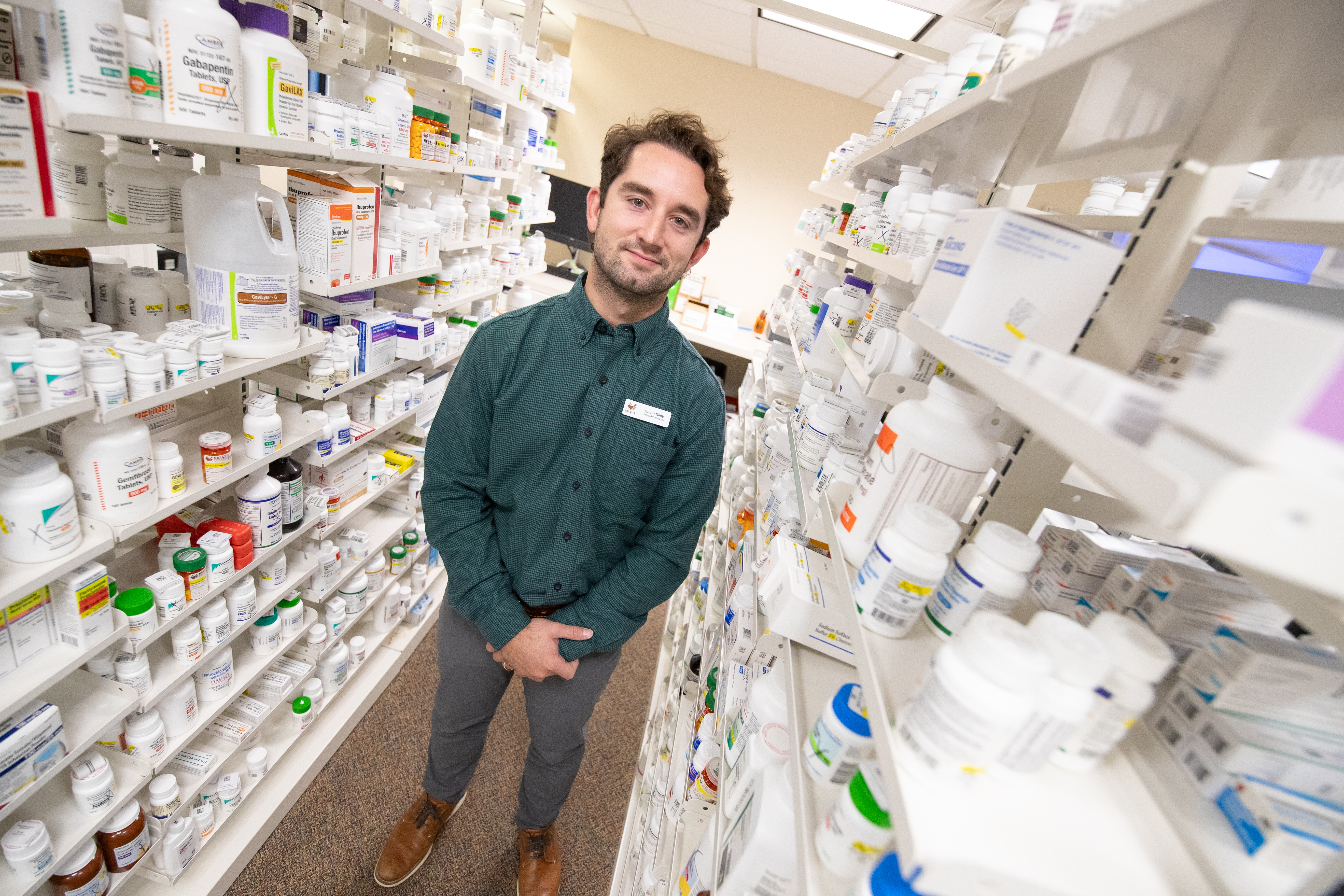 Dr. Quinn Kelly '18 in his pharmacy in Delmar