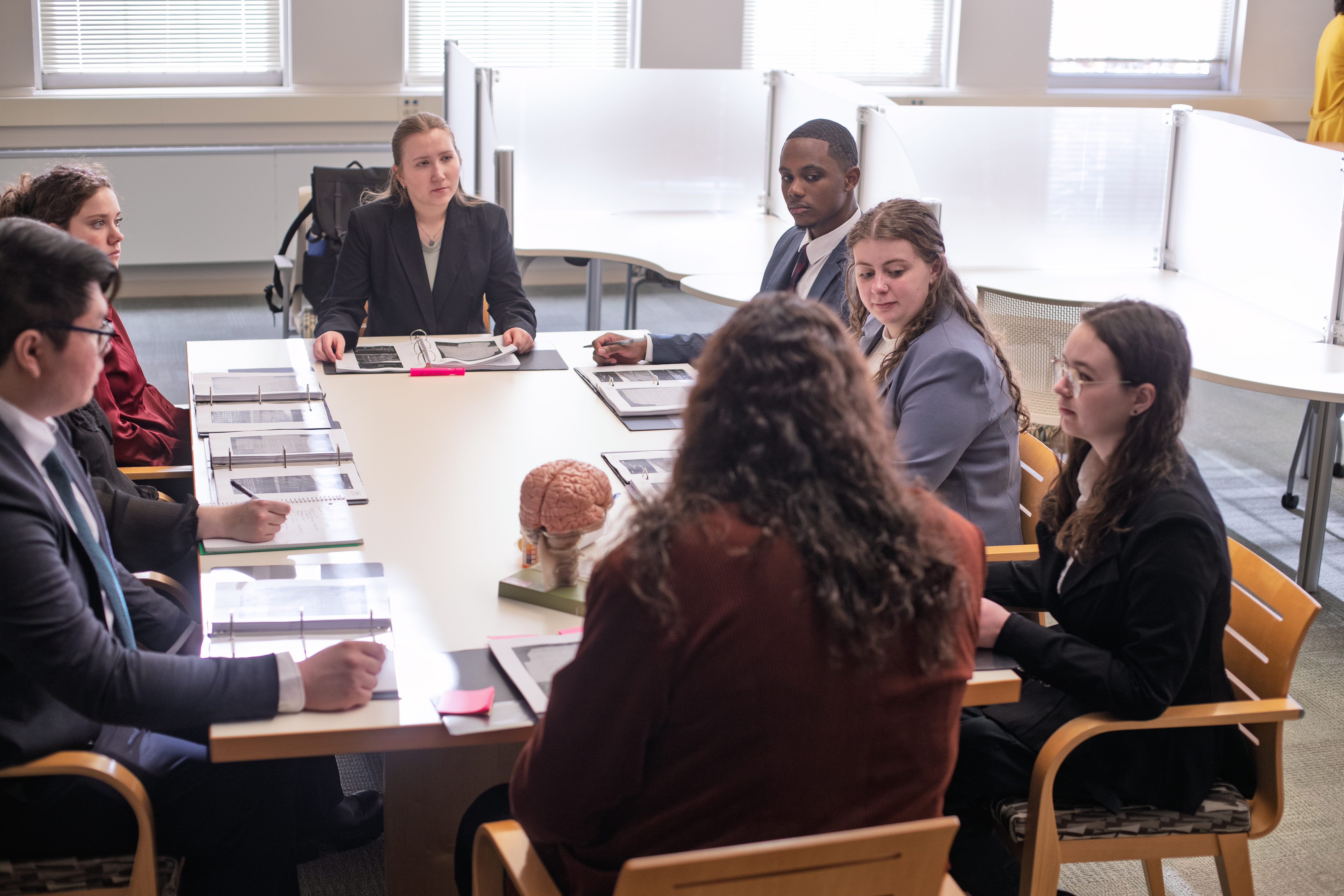 ACPHS Mock Trial Team members going over their roles at a dress rehearsal