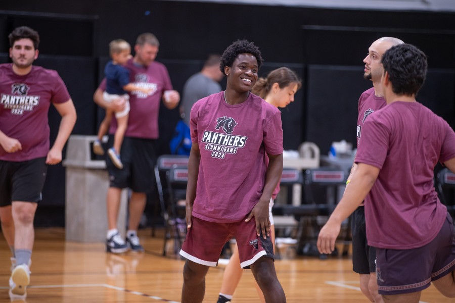 Happy ACPHS alumni play a basketball game during alumni weekend