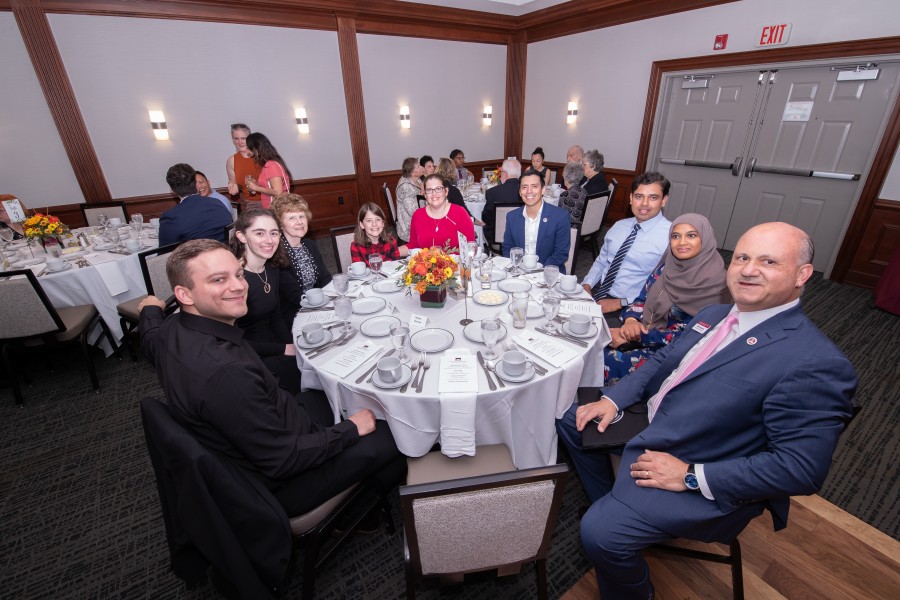 Institutional Advancement, ACPHS staff and alumni sit together at alumni awards dinner