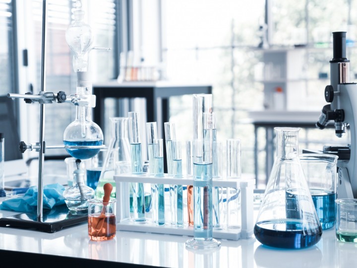 A lab space is displayed with several beakers